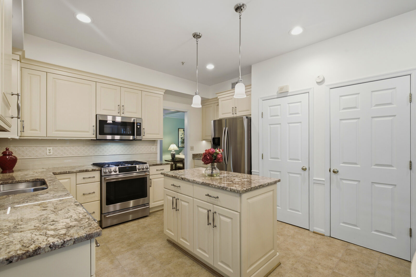 Updated kitchen with granite counters, center island and stainless appliances